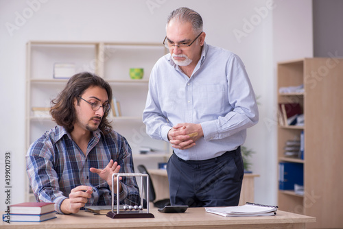 Two employees and meditation balls in the office