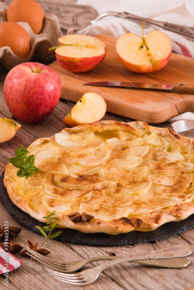 Apple tart with sugar cinnamon topping.
Apple tart with sugar cinnamon topping.