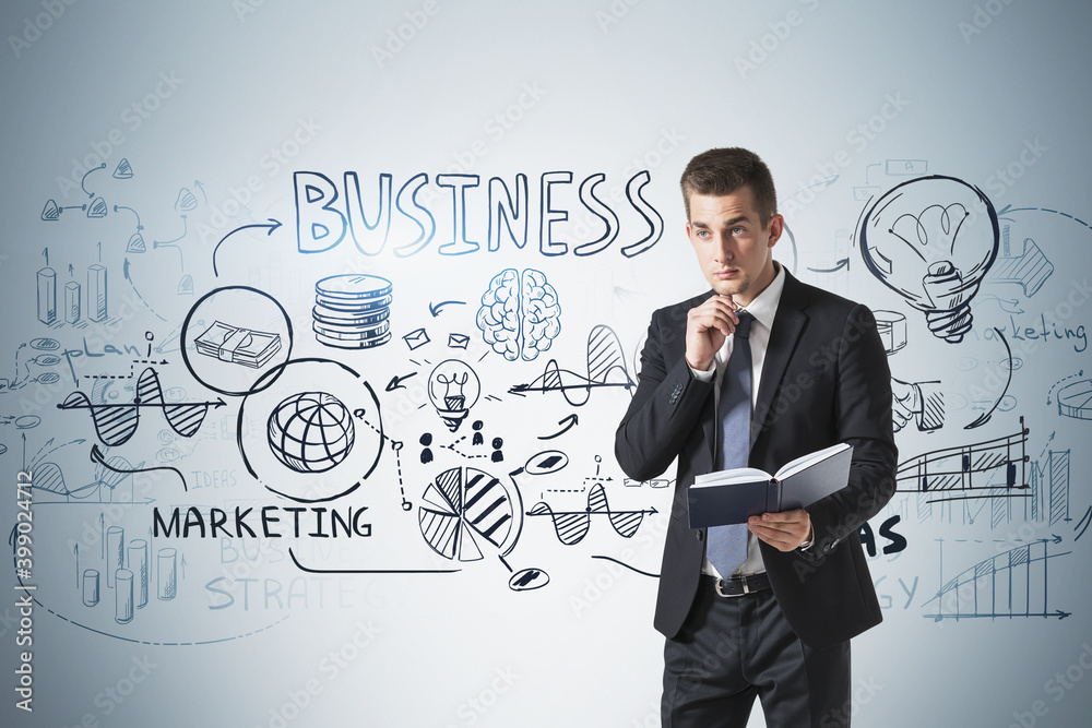 Man with book and his business plan Man with book and his business plan