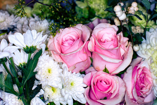 Close-up of a mixed bouquet of roses summer flowers background.