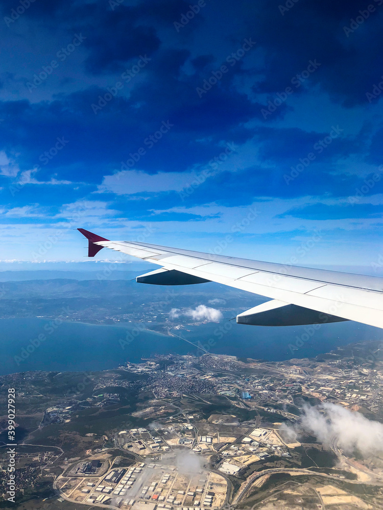 Airplane wing in the sky.