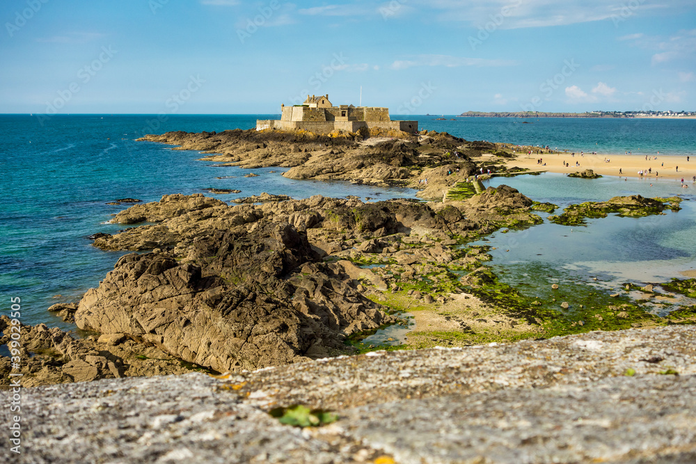 Fort National on tidal island Petit Be in Saint-Malo. Saint-Malo is a walled port city in Brittany in France
