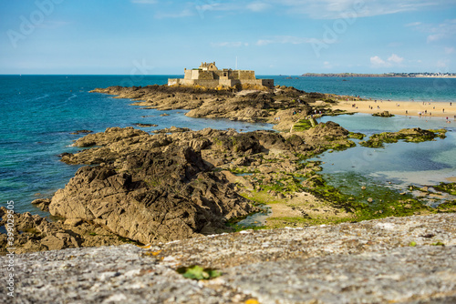 Fort National on tidal island Petit Be in Saint-Malo. Saint-Malo is a walled port city in Brittany in France