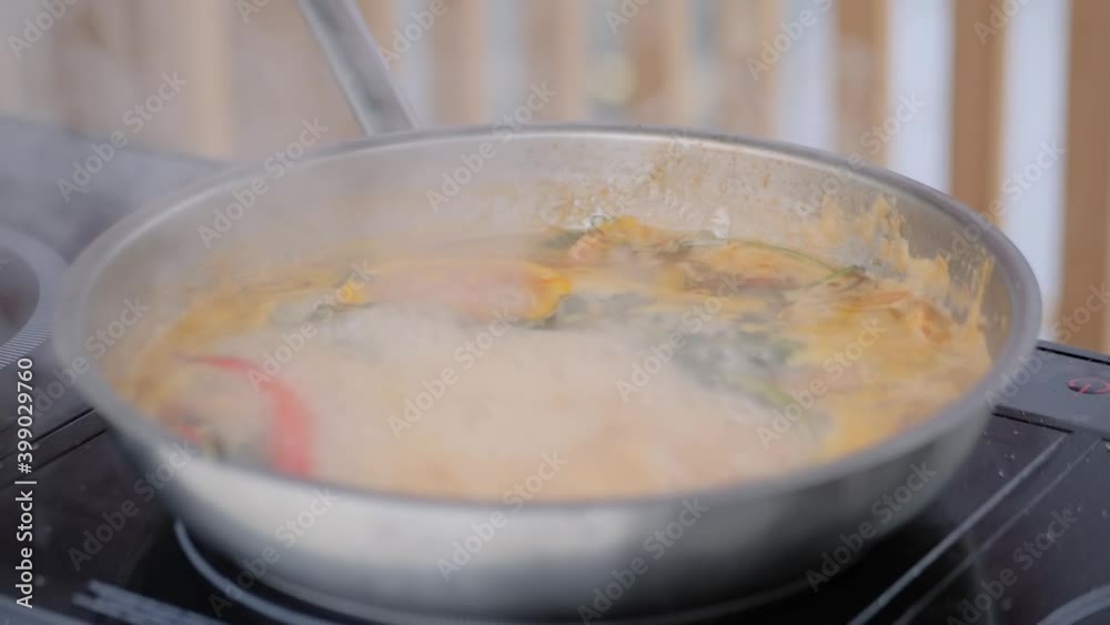 Slow motion: process of cooking vegetables in pan at summer food market - close up. Outdoor cooking, barbecue, gastronomy, cookery, street food concept Slow motion: process of cooking vegetables in pan at summer food market - close up. Outdoor cooking, barbecue, gastronomy, cookery, street food concept