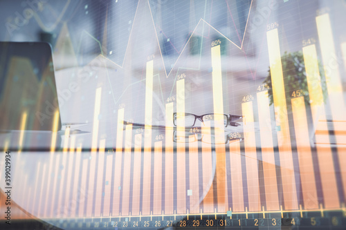 Double exposure of financial graph drawing and office interior background. Concept of stock market.