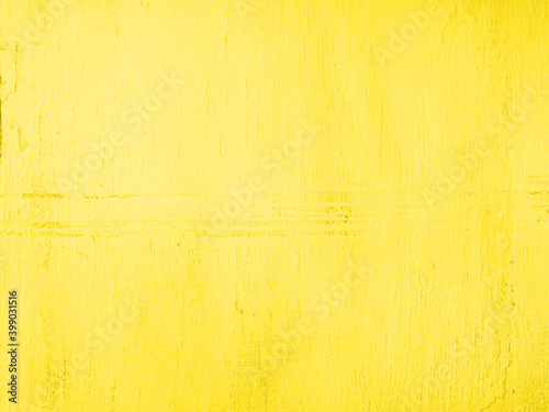 Illuminating yellow pastel wooden textured background. Spring easter backdrop