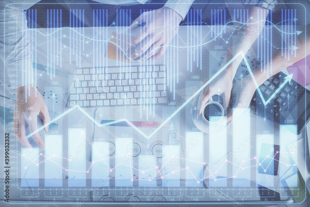Double exposure of man and woman working together and financial chart hologram drawing. market analysis concept. Computer background. Top View.