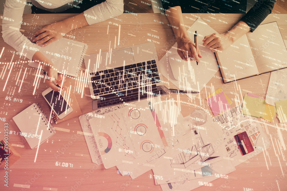 Double exposure of woman hands working on computer and forex graph hologram drawing. Top View. Financial analysis concept. Double exposure of woman hands working on computer and forex graph hologram drawing. Top View. Financial analysis concept.