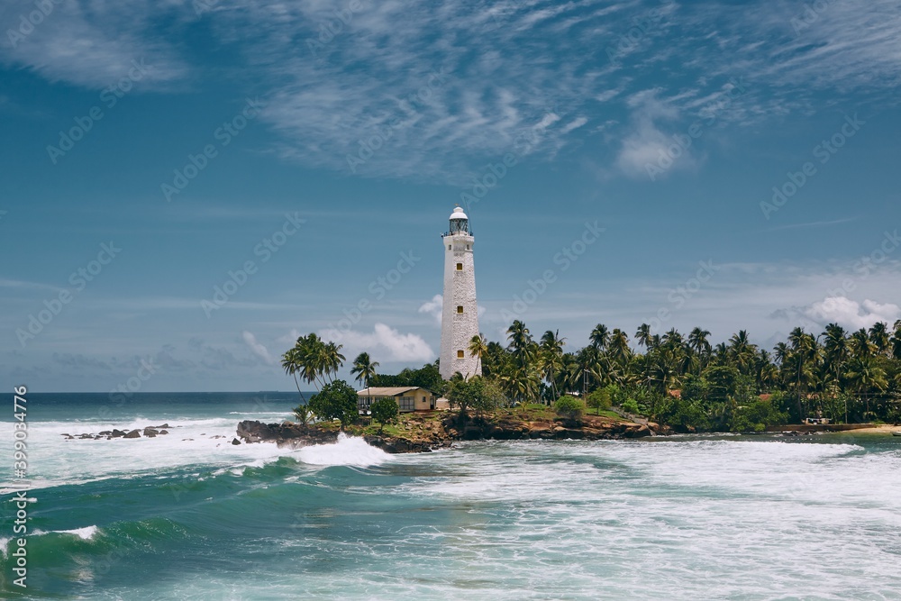 Lighthouse in the middle of palm trees