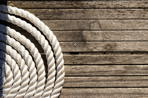Wooden sea background with nautical rope © Anastasia Prisunko
