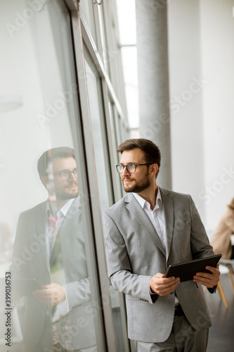 Young businessman standing ...