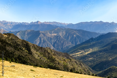Valley of mountains in the region of the high of the Pyrenees, with blue sky, near the city of Sort, province of Lérida, autonomous community of Catalonia, Spain