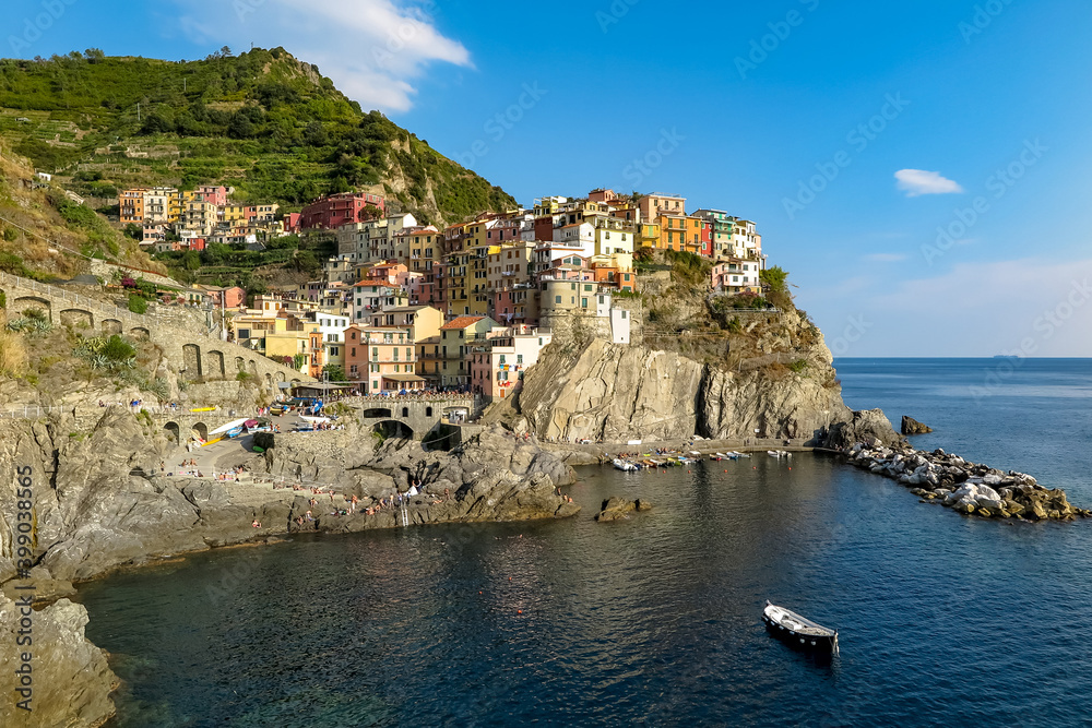 Commune of Manarola, with its colorful houses, on the stone cliffs by the sea, La Spezia Province, one of the towns that make up the famous Cinque Terre, Italy