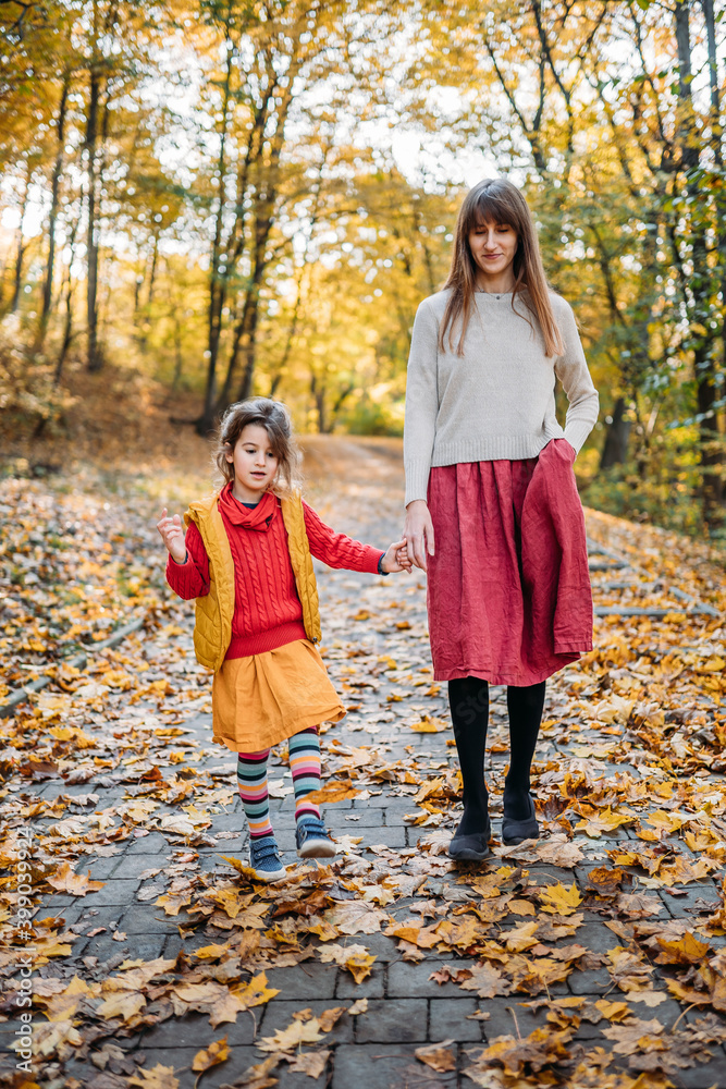 mom with emotional and hyperactive daughter are walking in the park mom with emotional and hyperactive daughter are walking in the park