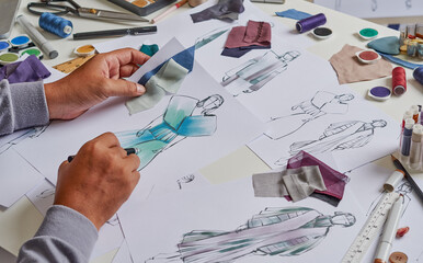 Fashion designer stylish drawings sketches textile fabric material Costume. Designer creative workshop studio.