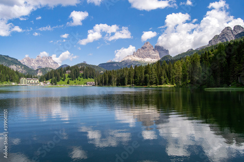 Fototapeta Naklejka Na Ścianę i Meble -  Relaxing view of the beutiful Misurina Lake in Dolomites mountains Sudtirol Italy  with mountains reflections in the still water and a forest in background Travel concept