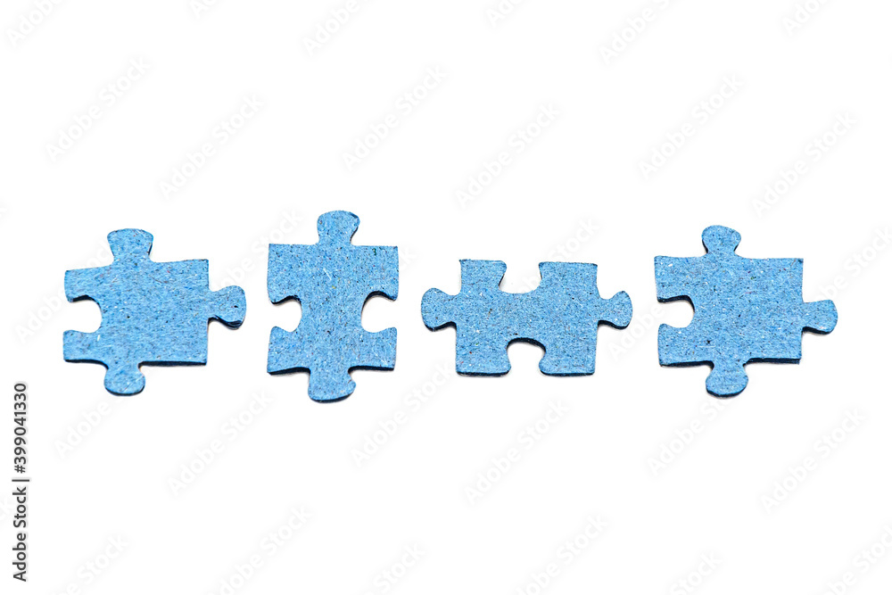 Row of four disconnected blue jigsaw puzzle pieces isolated on white background. Board home games and puzzles. Symbol of quarantine soothing activity. Concept of disunity, inconsistency. Row of four disconnected blue jigsaw puzzle pieces isolated on white background. Board home games and puzzles. Symbol of quarantine soothing activity. Concept of disunity, inconsistency.