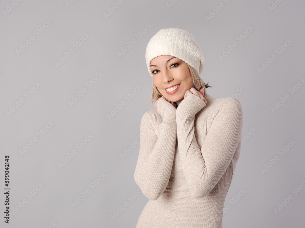 Pretty young woman poses in tight dress and hat with cheerful fitness Pretty young woman poses in tight dress and hat with cheerful fitness