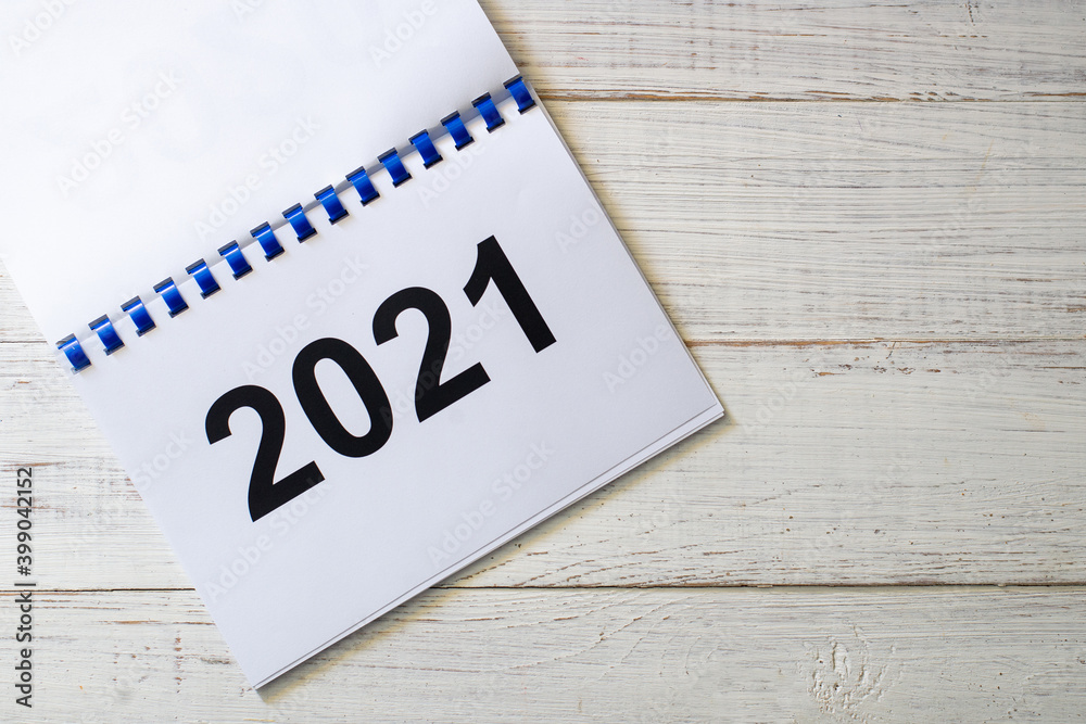 Numbers 2021 on notepad over white background.Change of year. Numbers 2021 on notepad over white background.Change of year.