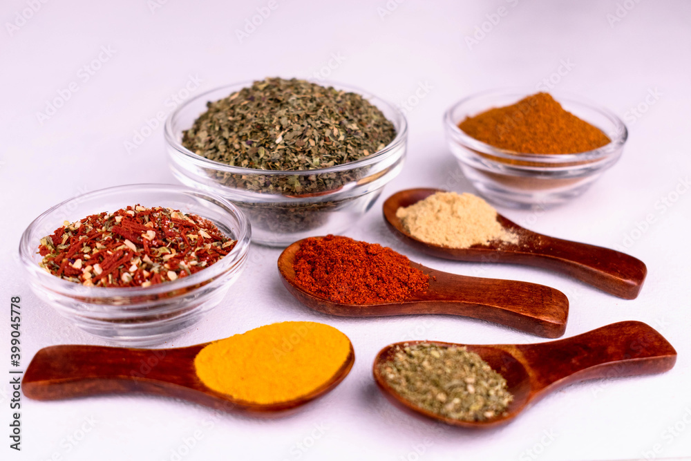 Different bright spices on a white background.
Close-up.
