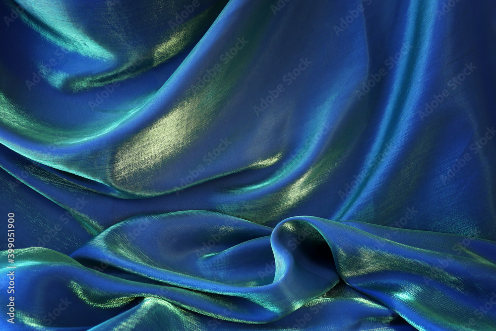 Blue, green and gold silk fabric texture background Blue, green and gold silk fabric texture background