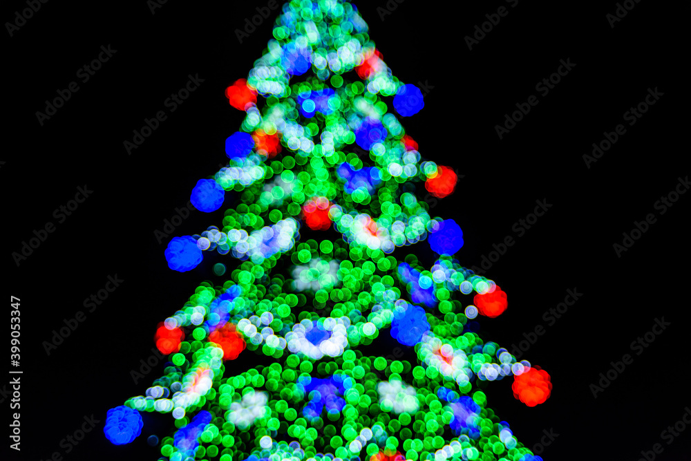 Background of the blurred colorful christmas lights. Bokeh pattern Background of the blurred colorful christmas lights. Bokeh pattern