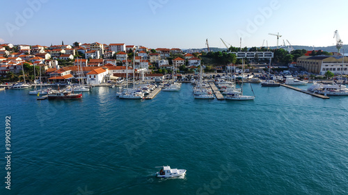 Panoramic view of harbor in Torgir with a sailing boat