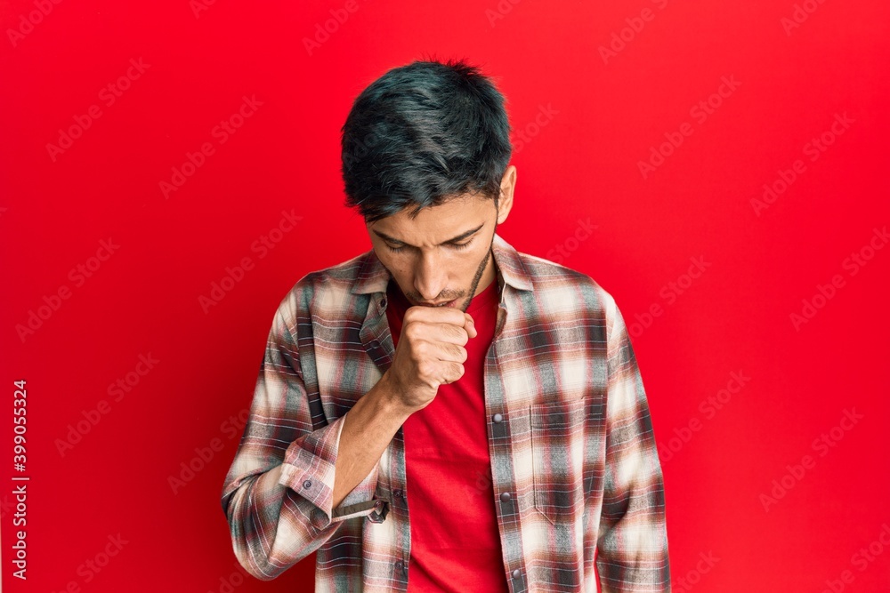 Young handsome man wearing casual clothes feeling unwell and coughing as symptom for cold or bronchitis. health care concept.