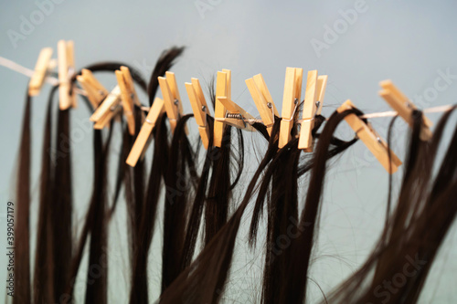 Women s hair is dried on a clothesline. Selective focus