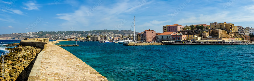 A panorama view across the inner harbour in Chania, Crete on a bright sunny day
