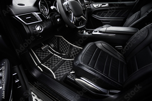 Modern interior of the car - rear seats with seat belts. black leather interior © Кристина Пахомова