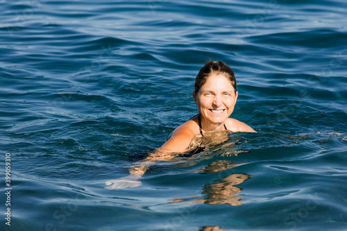 Happy woman swimming in sea © amelie