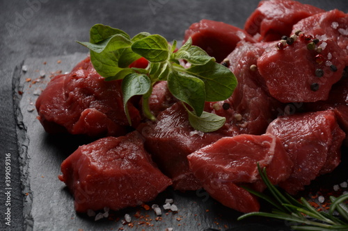 Diced raw beef with ingredients, herbs and spices