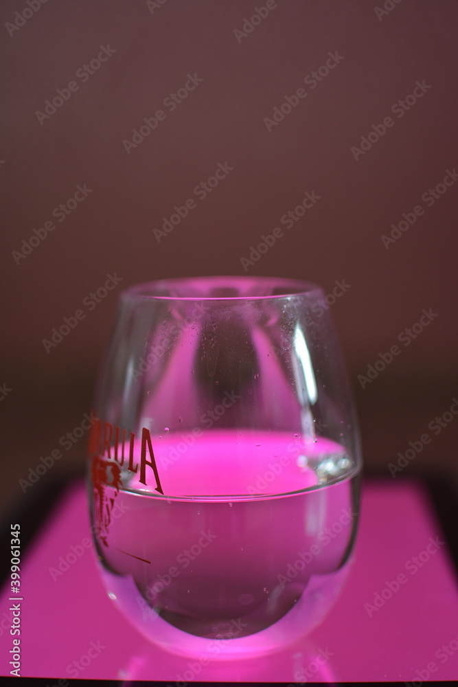 cold and fresh liquid lit from beneath with pink light cold and fresh liquid lit from beneath with pink light