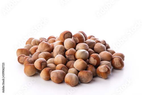 Hazelnuts heap isolated on white background
