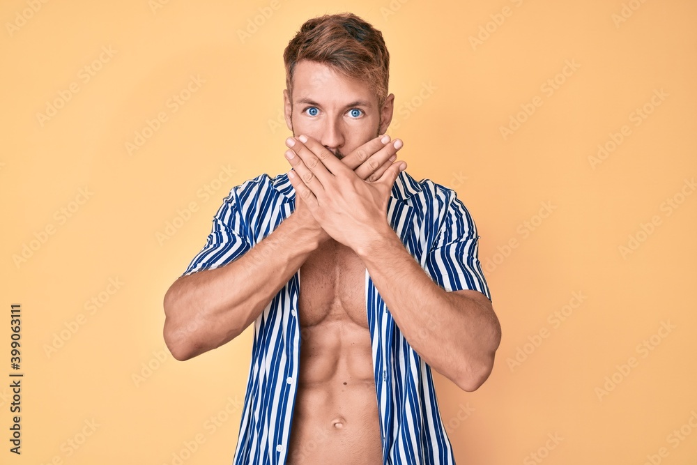 Fototapeta premium Young caucasian man wearing summer style shocked covering mouth with hands for mistake. secret concept.