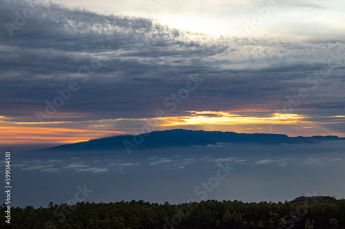 Sunset from El Teide National Park. A cloudy sunset with the sun peaking through it