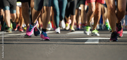 Marathon running race, runners feet on road, sport, fitness and healthy lifestyle concept