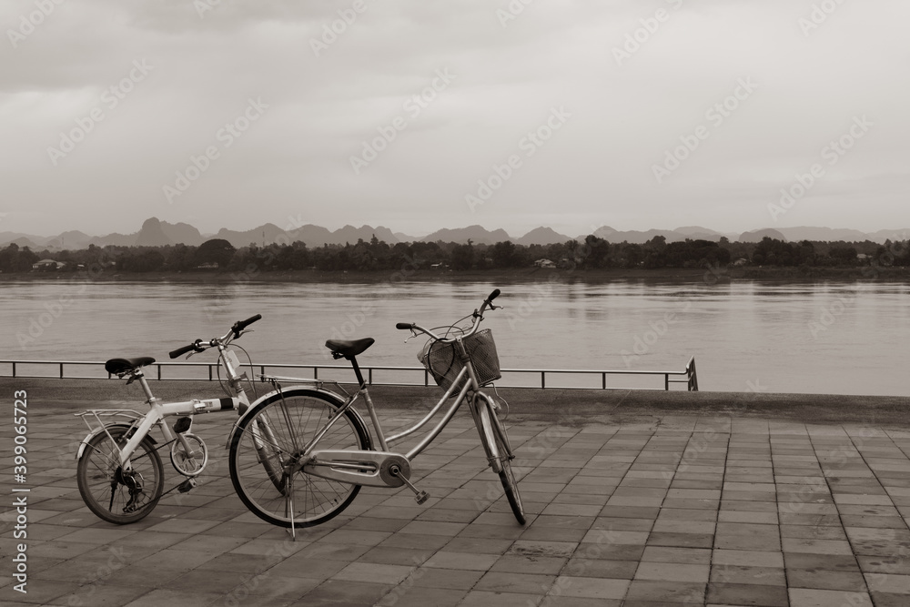 Fototapeta premium desaturated picture of two bicycle parking near riverside