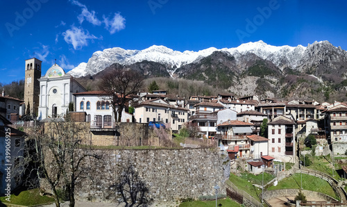 Panorama of the village of Poffabro, one of the most beautiful villages in Italy, with the snowed Mount Raut, in the Friulian Dolomites natural park photo