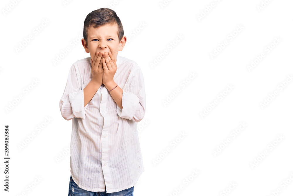 Cute blond kid wearing elegant shirt laughing and embarrassed giggle covering mouth with hands, gossip and scandal concept Cute blond kid wearing elegant shirt laughing and embarrassed giggle covering mouth with hands, gossip and scandal concept