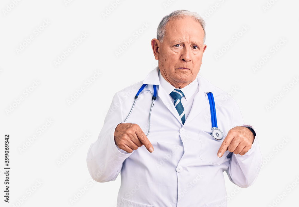 Senior handsome grey-haired man wearing doctor coat and stethoscope pointing down looking sad and upset, indicating direction with fingers, unhappy and depressed. Senior handsome grey-haired man wearing doctor coat and stethoscope pointing down looking sad and upset, indicating direction with fingers, unhappy and depressed.
