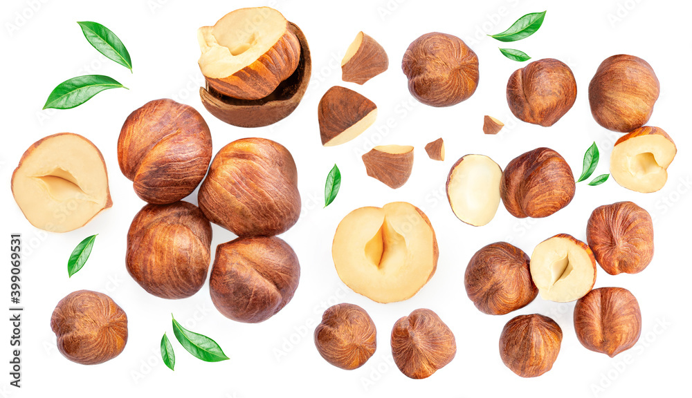 Hazelnuts with green leaves isolated on a white background. Creative food layout. Pattern with hazelnuts. Flat lay Hazelnuts with green leaves isolated on a white background. Creative food layout. Pattern with hazelnuts. Flat lay