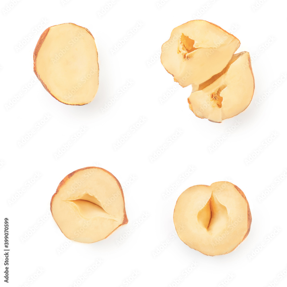 Halved piece of Hazelnut isolated on white background. Creative layout. Top view. Flat lay. Halved piece of Hazelnut isolated on white background. Creative layout. Top view. Flat lay.