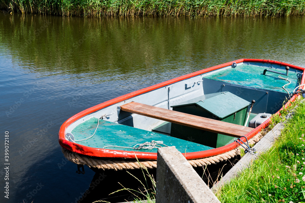 small boat in water. Broek op Langedijk, The Netherlands. 