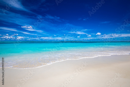 Beach and tropical sea. Stunning summer landscape, shore, coast with calm waves, relaxing seascape horizon over white sand blue sky. Tranquil nature pattern, beach concept. Travel vacation, copy space