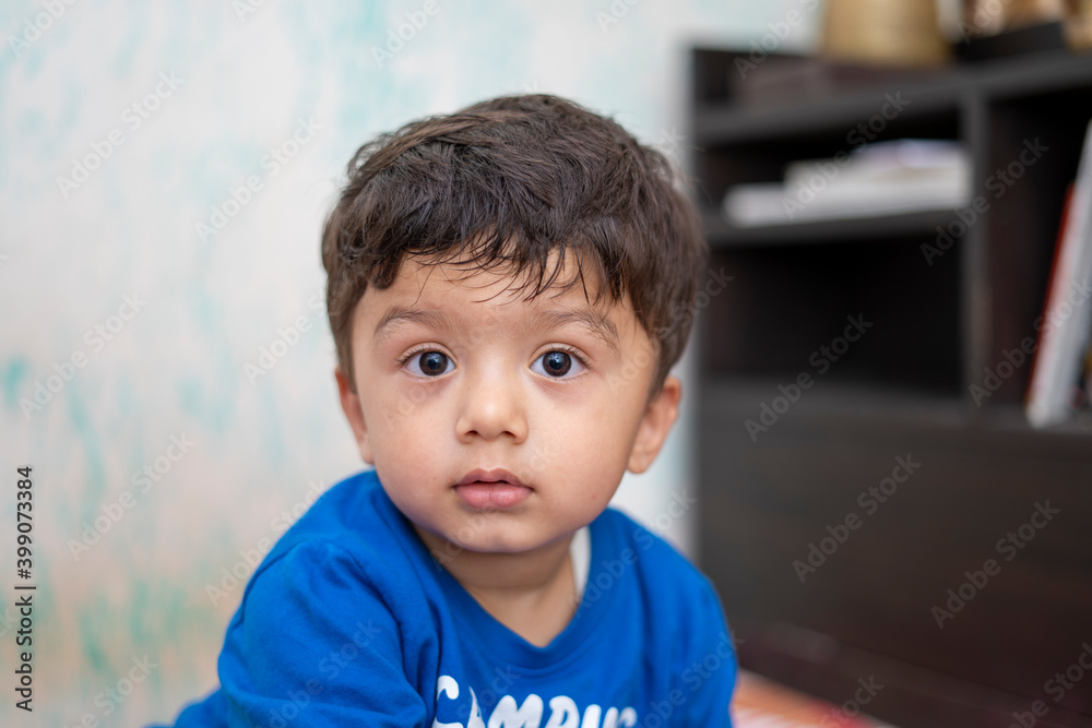 Portrait of a young indian infant kid with innocent eyes. Portrait of a young indian infant kid with innocent eyes.