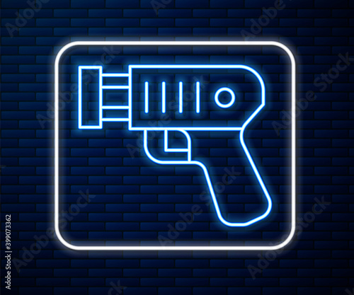 Glowing neon line Police electric shocker icon isolated on brick wall background. Shocker for protection. Taser is an electric weapon. Vector.