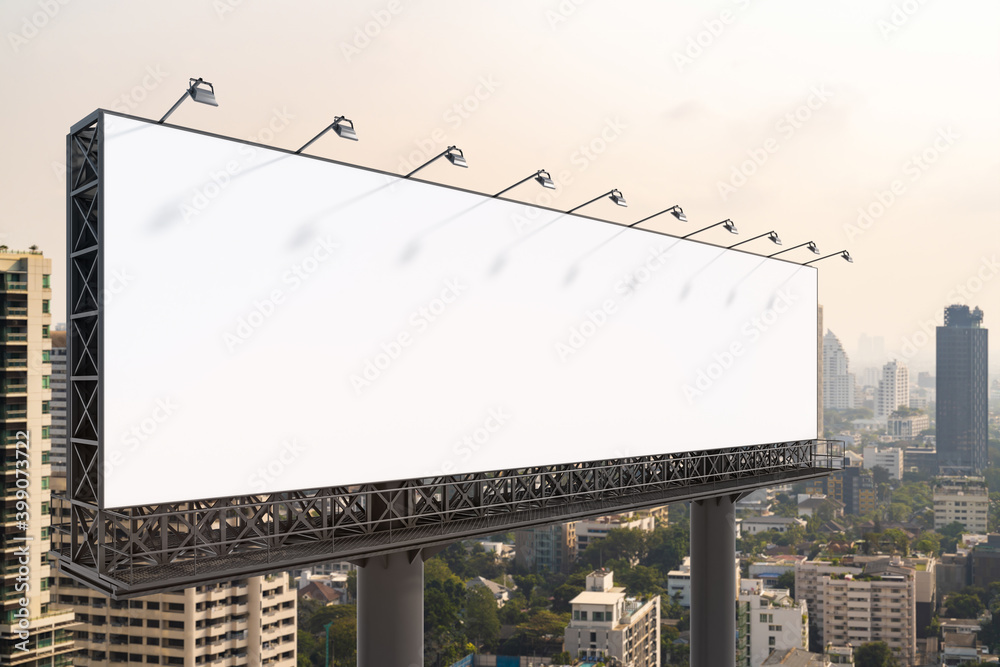 Blank white road billboard with Bangkok cityscape background at day time. Street advertising poster, mock up, 3D rendering. Side view. The concept of marketing communication to promote or sell idea. Blank white road billboard with Bangkok cityscape background at day time. Street advertising poster, mock up, 3D rendering. Side view. The concept of marketing communication to promote or sell idea.