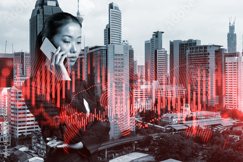 Photography Attractive Asian businesswoman trader processing conference call to forecast the capital market behavior